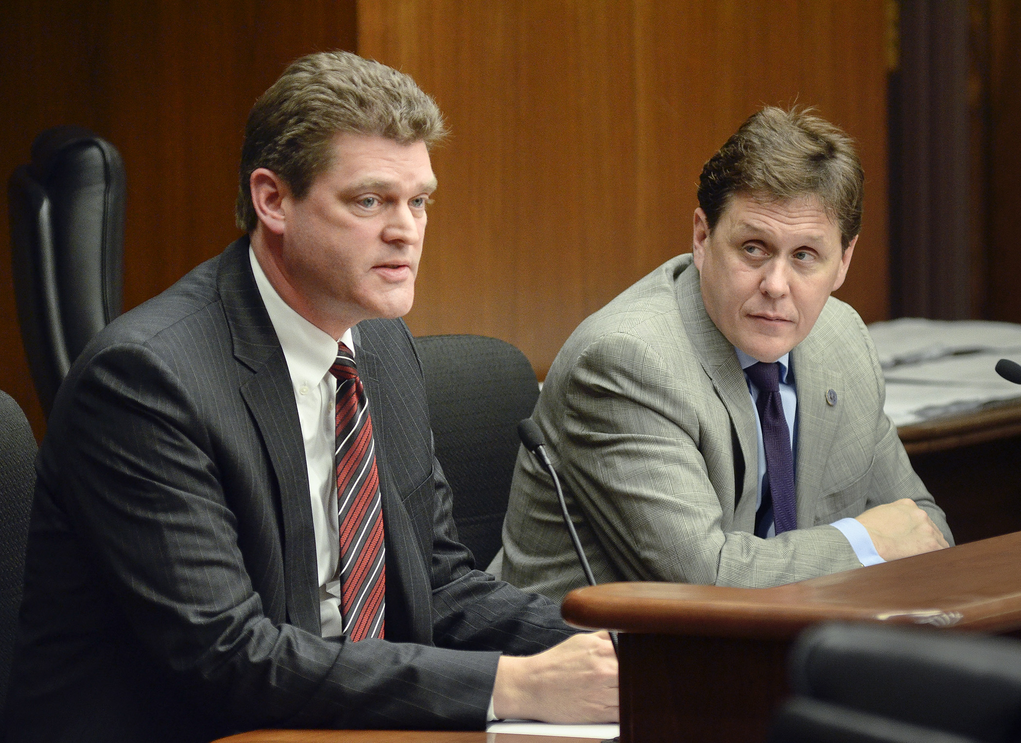 Dr. Paul Kettler, vice president of medical affairs at Unity Hospital, left, testifies before the House Health and Human Services Finance Committee Jan. 27 on a bill that would provide deficiency funding. Rep. Matt Dean, right, the committee chair, listens to the testimony. Photo by Andrew VonBank